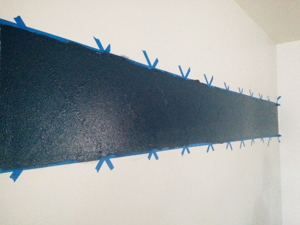 X on wall paint dark blue 2