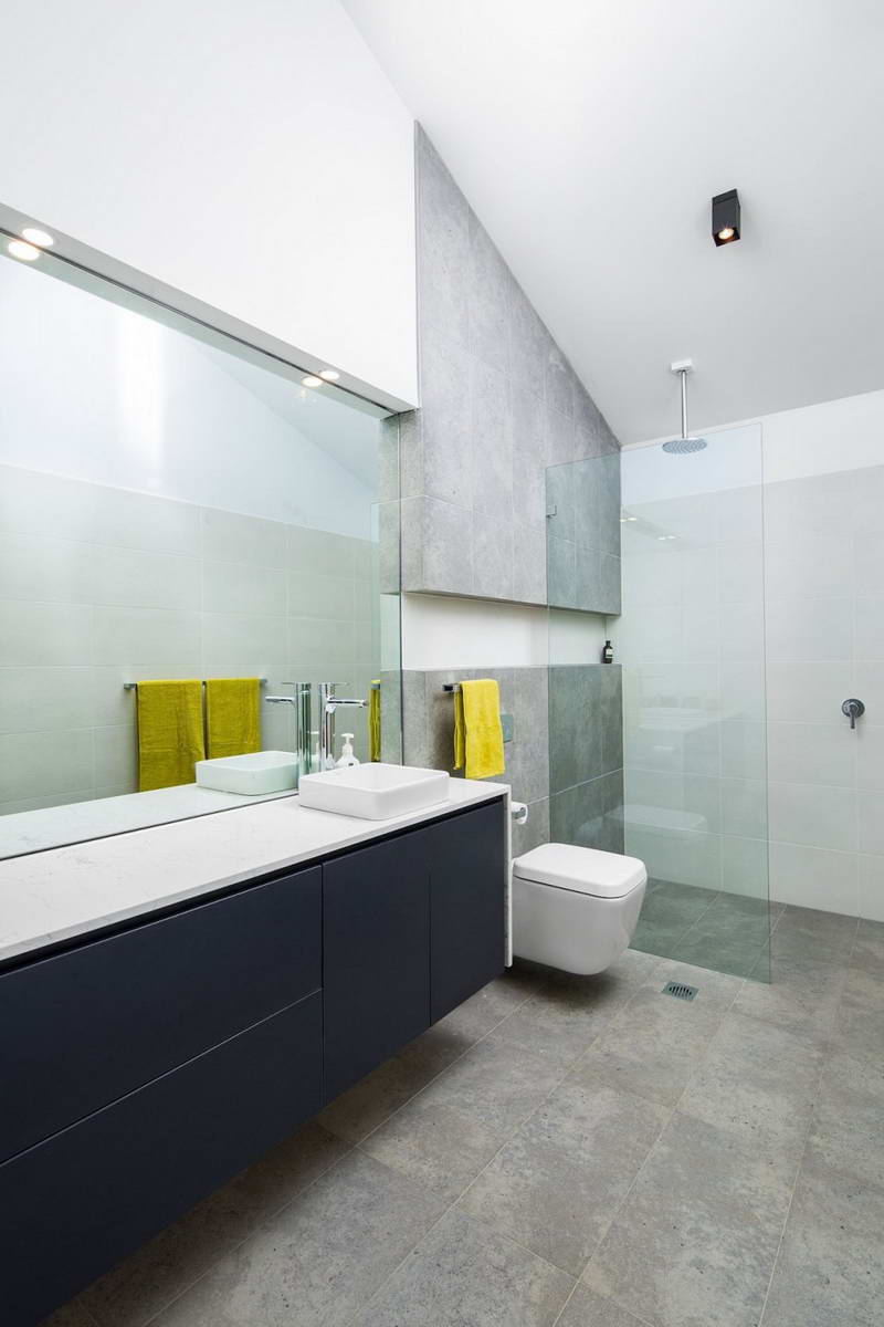 Yellow accents in a grey bathroom