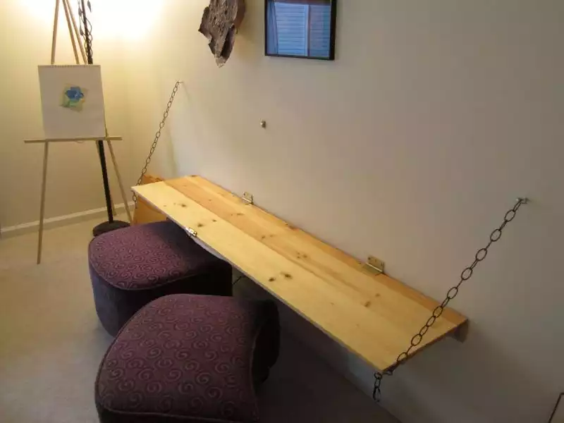 A desk, chalkboard and shelf combo