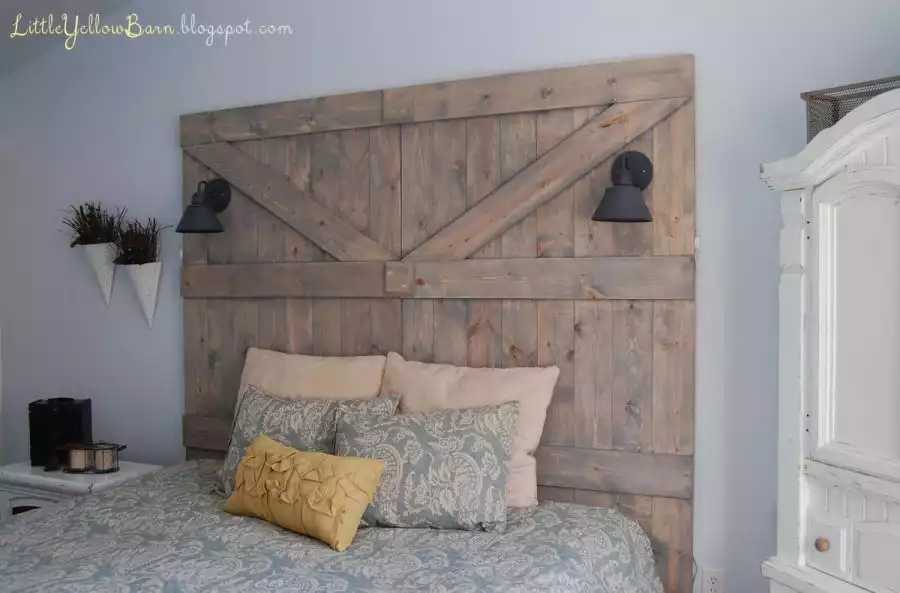 A wooden barn door-inspired headboard