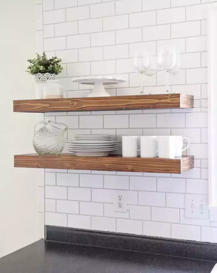 Add some warmth to the kitchen with wooden shelves