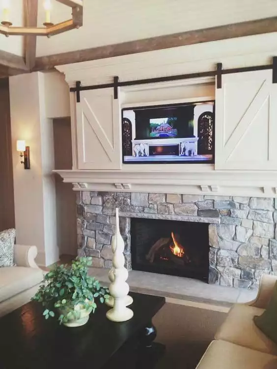 Barn doors for a wall mounted tv above the fireplace