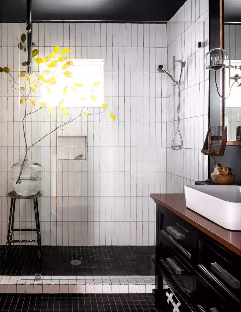 Bathroom with white vertical tiles and shower niche