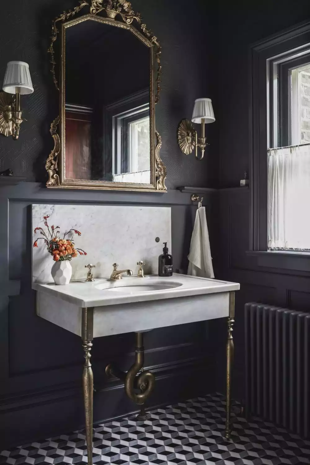 Beautiful bathroom with black and gold accents