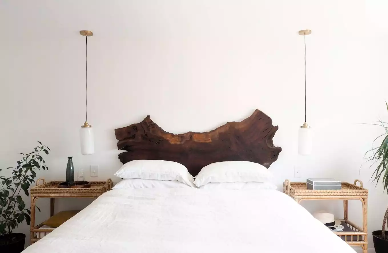 Beautiful clean bedroom featuring a wood headboard