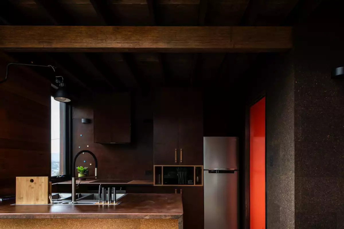 The primary colors in the interior design are fairly dark which creates a cozy cabin-like feel