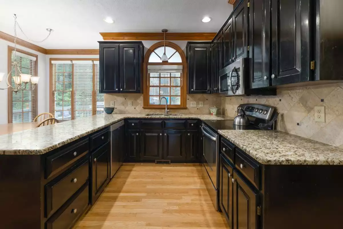 Black Cabinets with Light Brown Granite