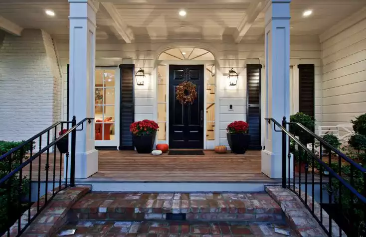 Black house exterior through windows fence and door