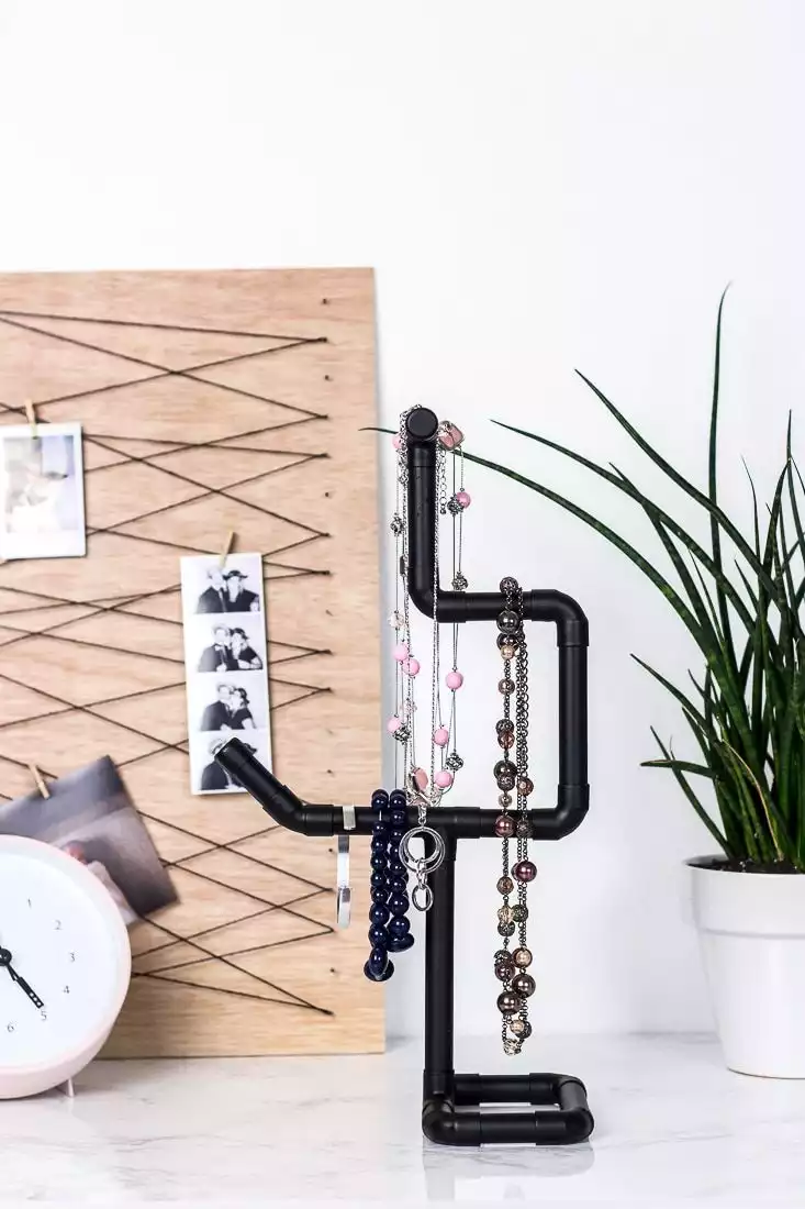 Spray-painted copper pipe jewelry holder