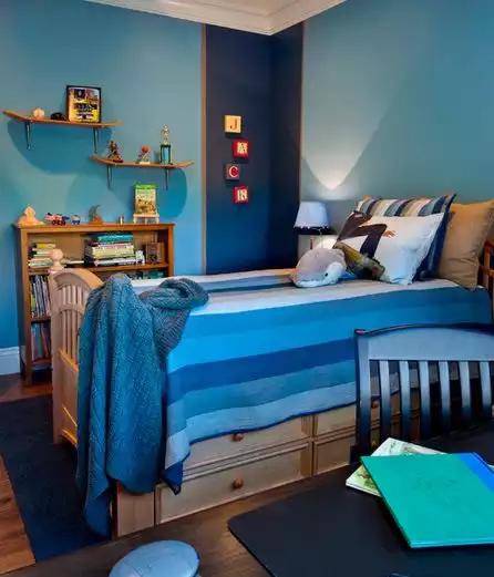 Blue teenage room with skateboard shelves on wall