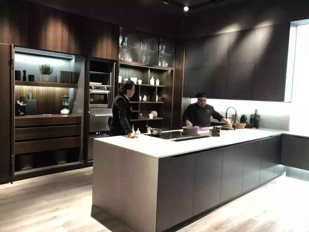 Brown kitchen cabinets with dark quartz
