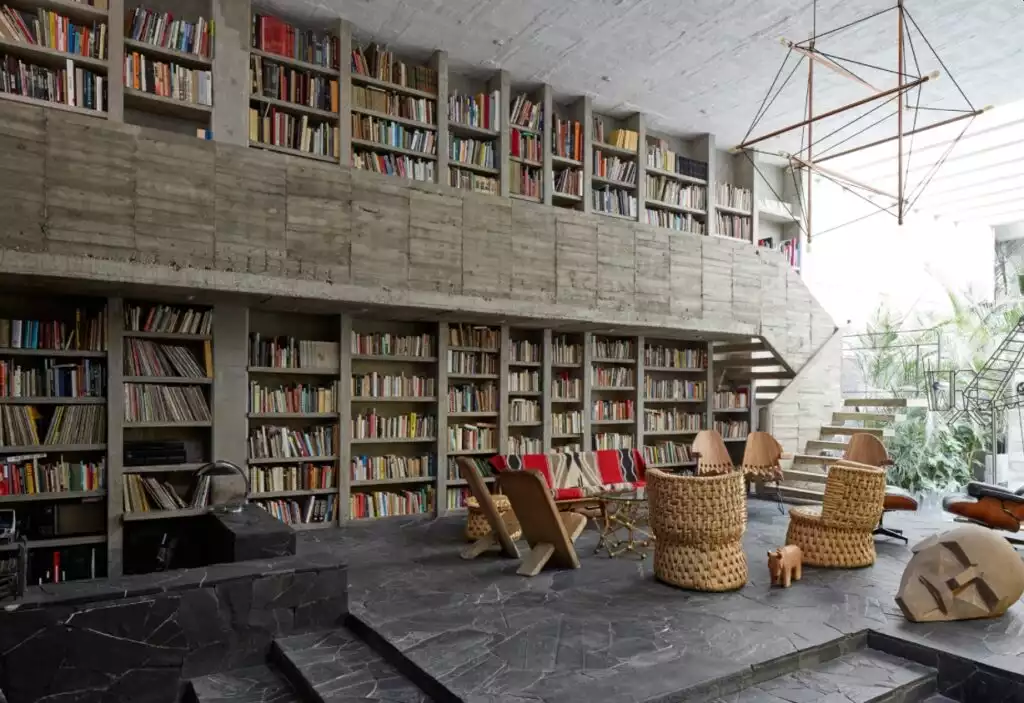 Double-height concrete bookshelves