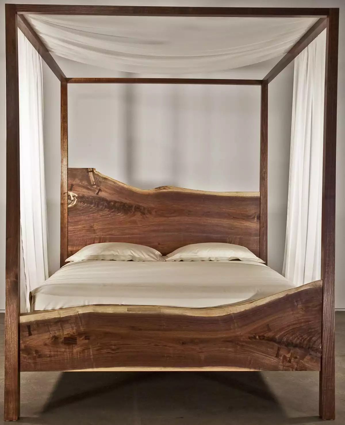 Canopy bed made with headboard and footboard from live edge wood