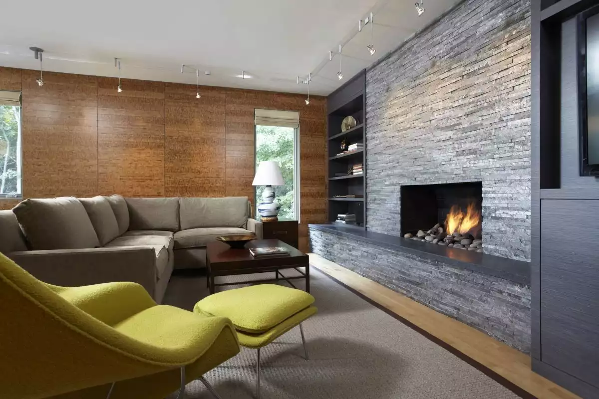 Modern living room with fireplace and accent chartreuse chair