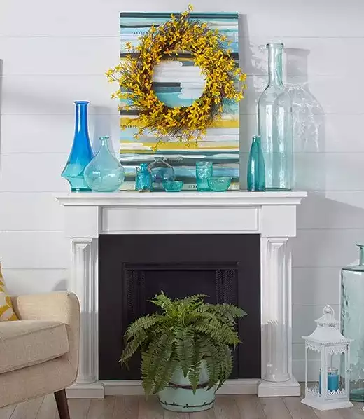 colorful vases on the fireplace mantel shelf