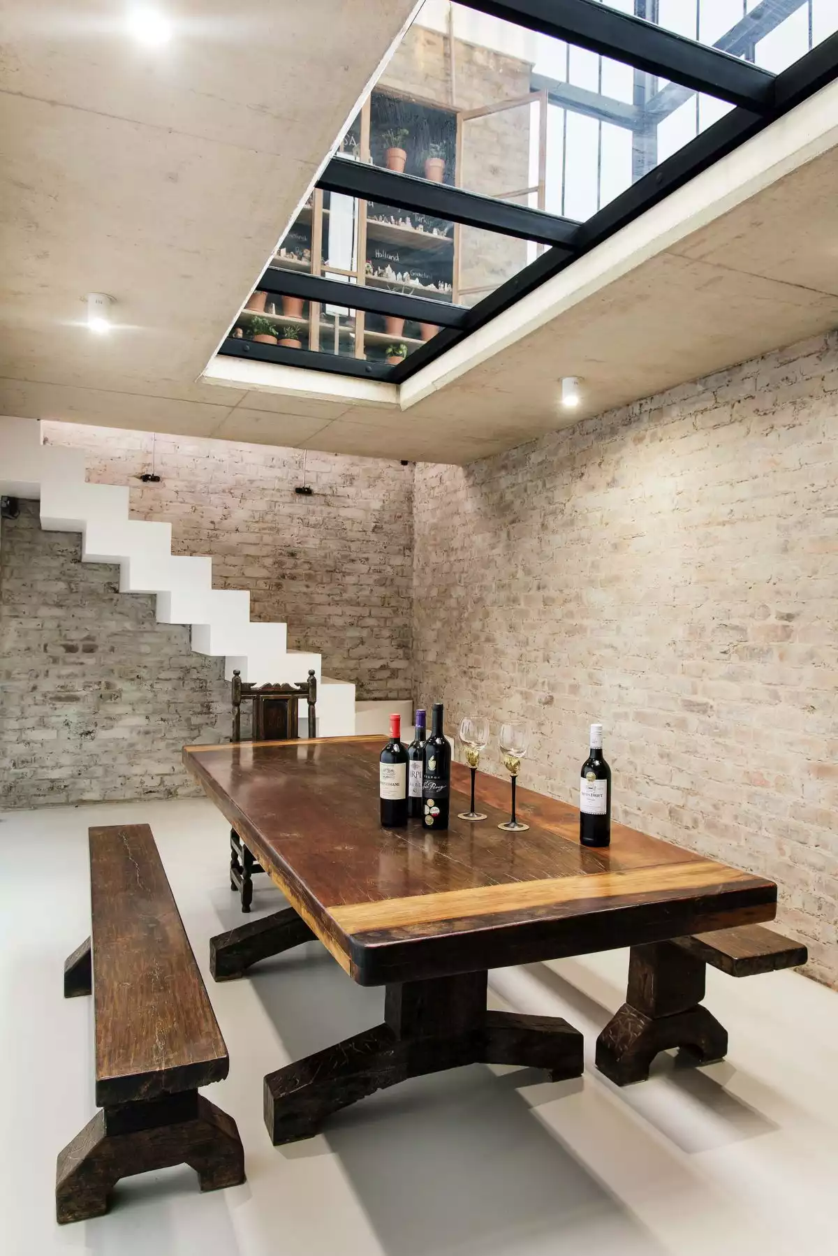 A secret staircase in the kitchen offers access to the underground wine cellar and a glass floor panel connects the two levels