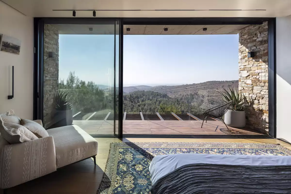 Contemporary Stone Cladding Villa by Dana Oberson Architects - bedroom view