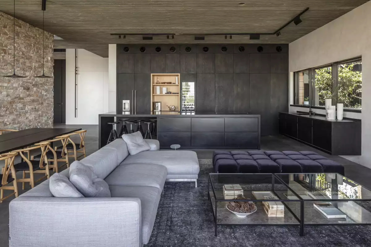 Contemporary Stone Cladding Villa by Dana Oberson Architects - kitchen island