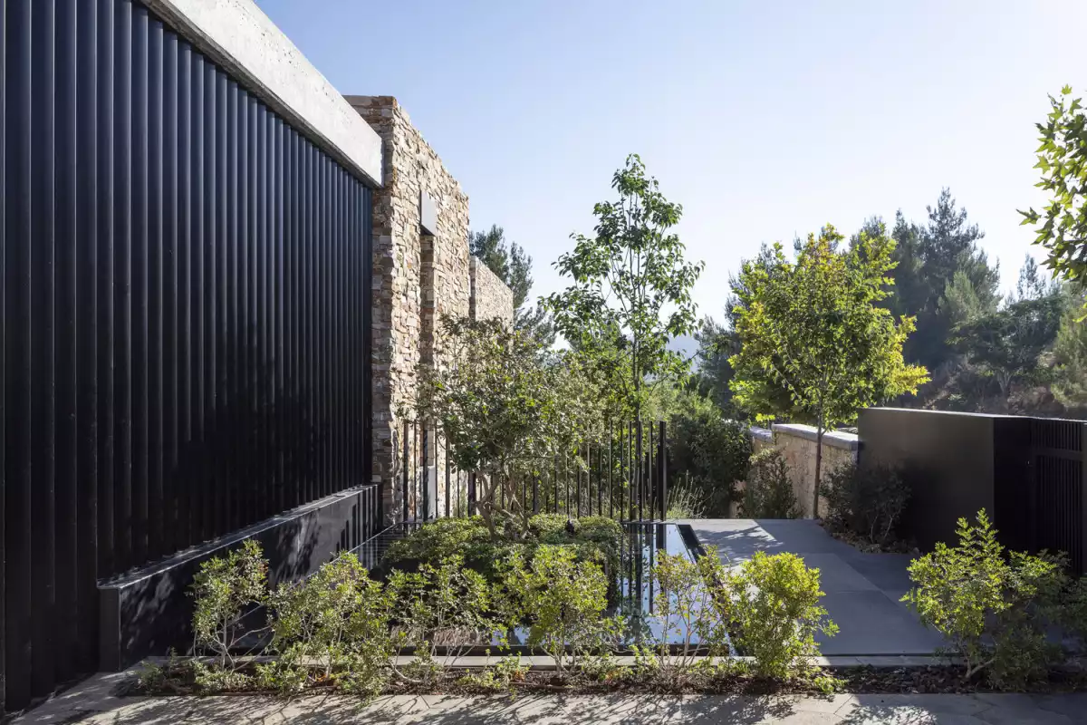 The terraced decks give a glimpse at the beautiful landscape unfolding in front of the house