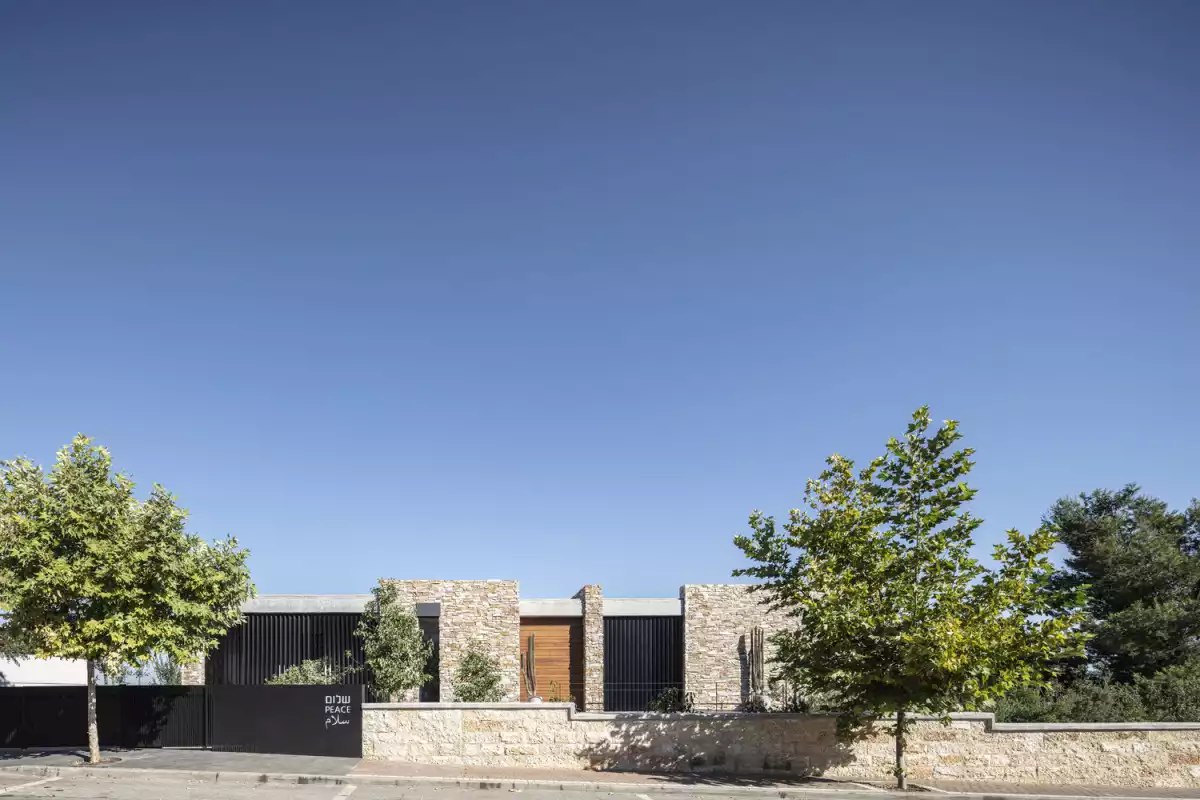 Contemporary Stone Cladding Villa by Dana Oberson Architects - street