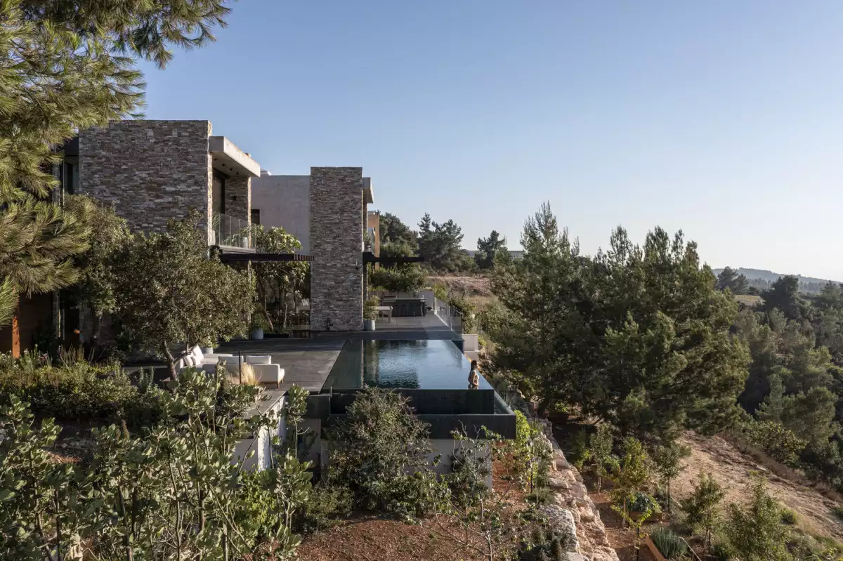 A Stone Cladding Villa That Serves As A Bridge Between Communities