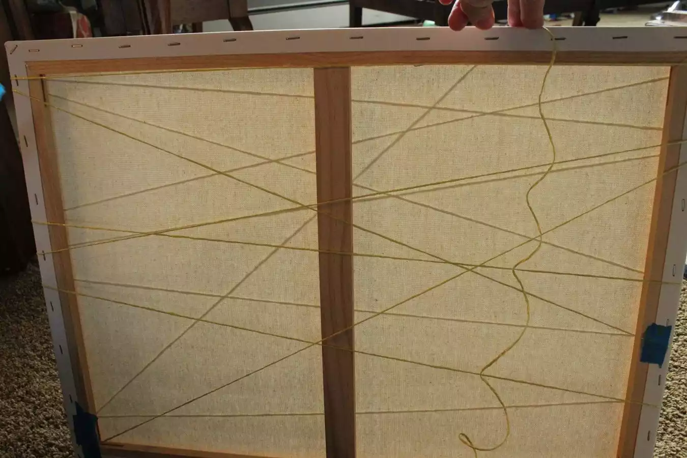 Step 2: Pull string in straight line across canvas