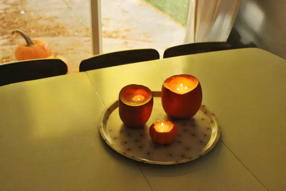 DIY Pumpkin Candles on Table