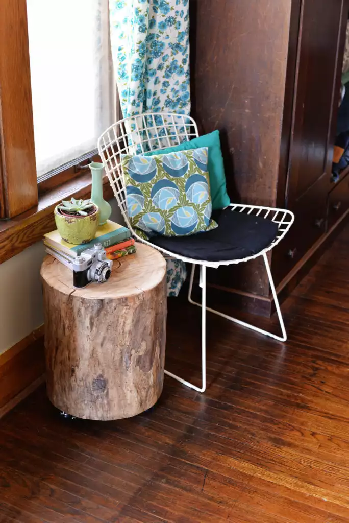 A tree stump table with wheels 