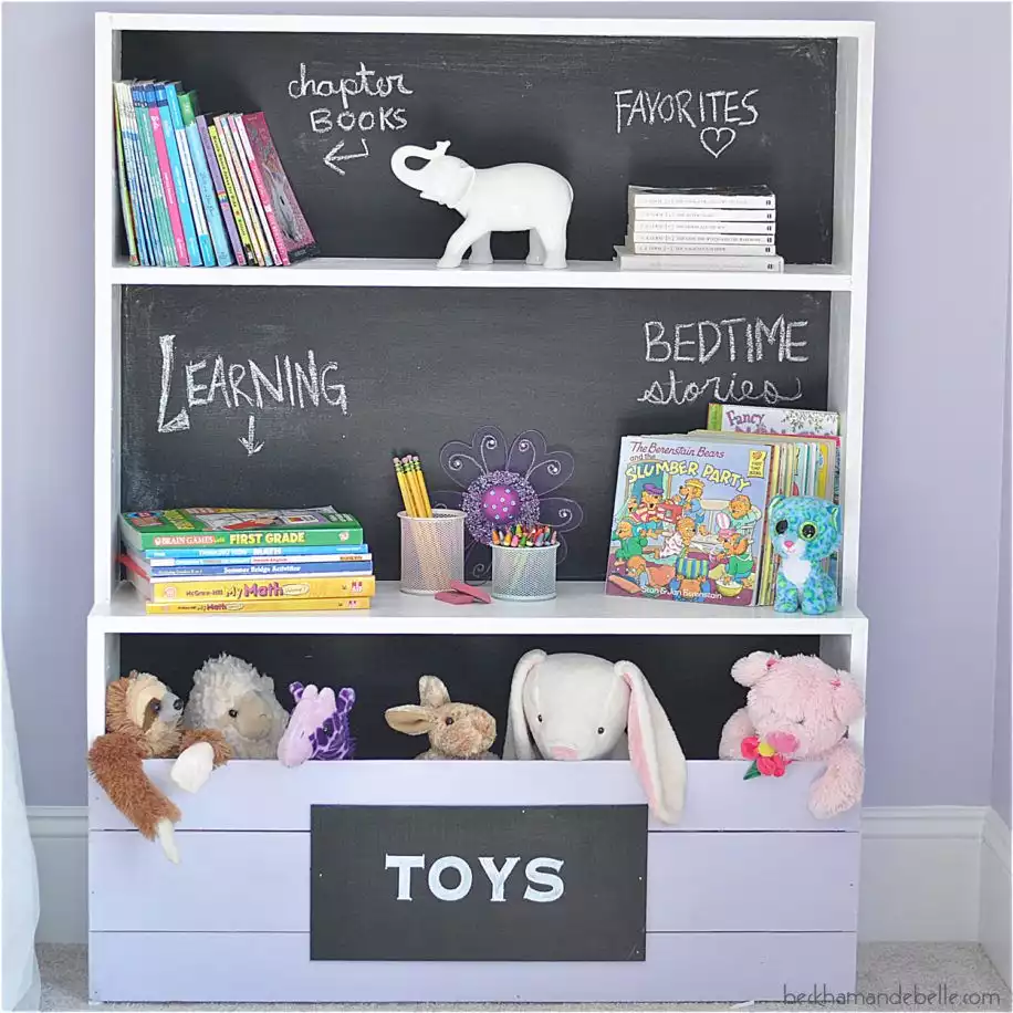 Bookcase with toy storage compartment and a chalkboard back panel