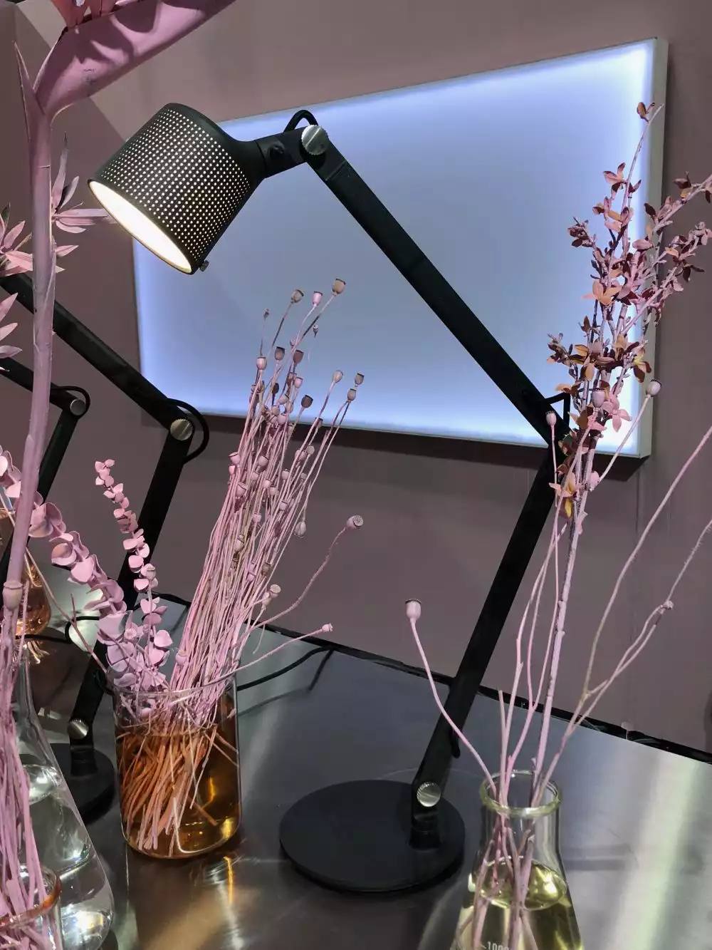 Decorating the office desk with pink shade fake flowers