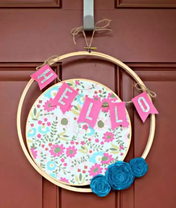 Modern wrath with bunting and fabric flowers