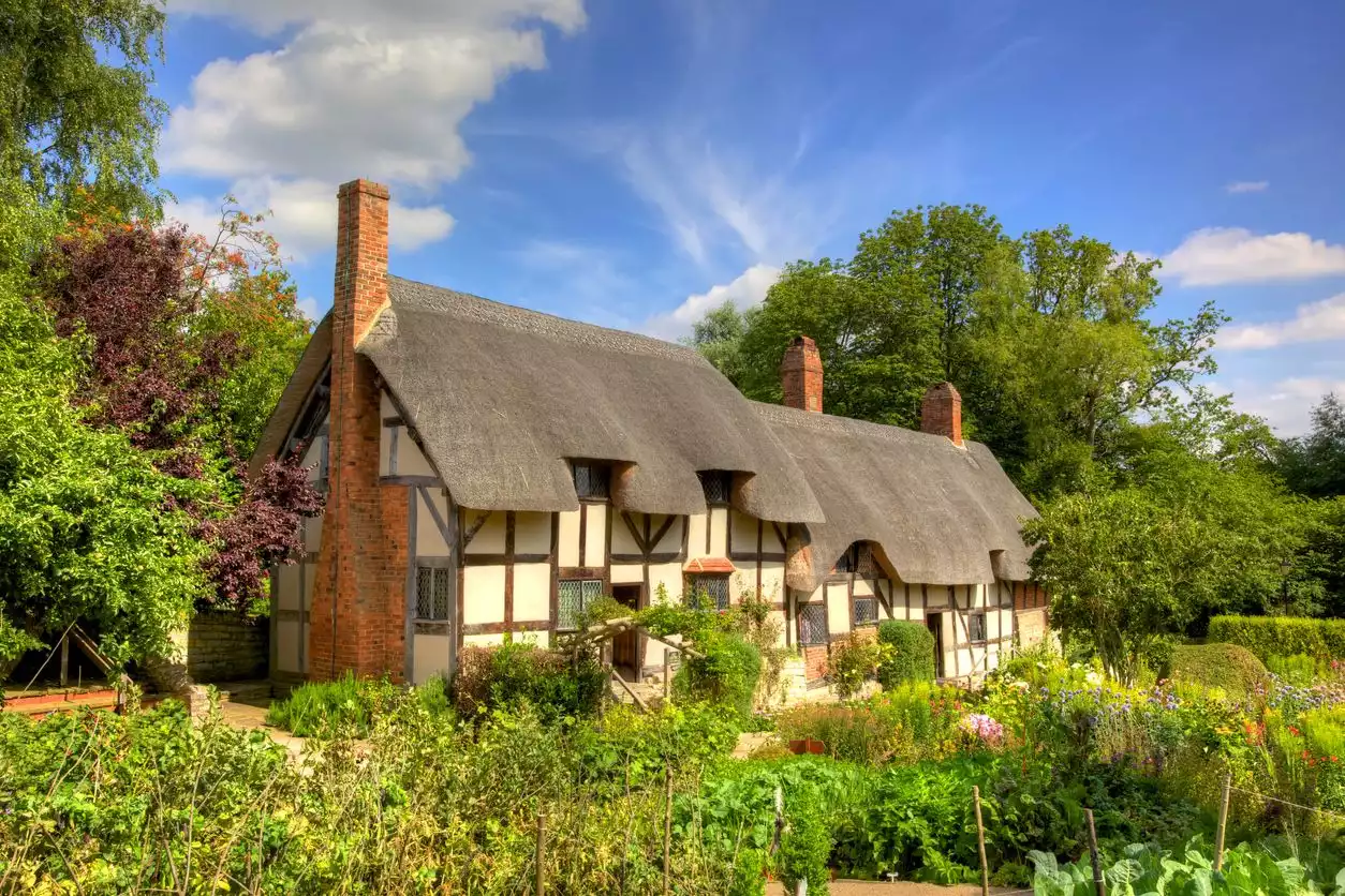 English cottage house with thatched roofs