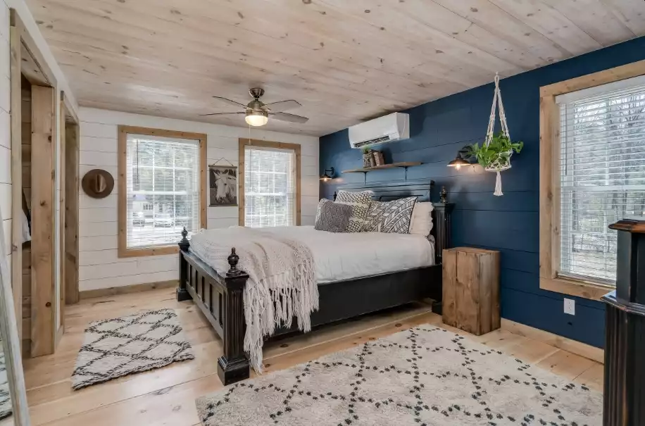 Farmhouse bedroom with blue wall