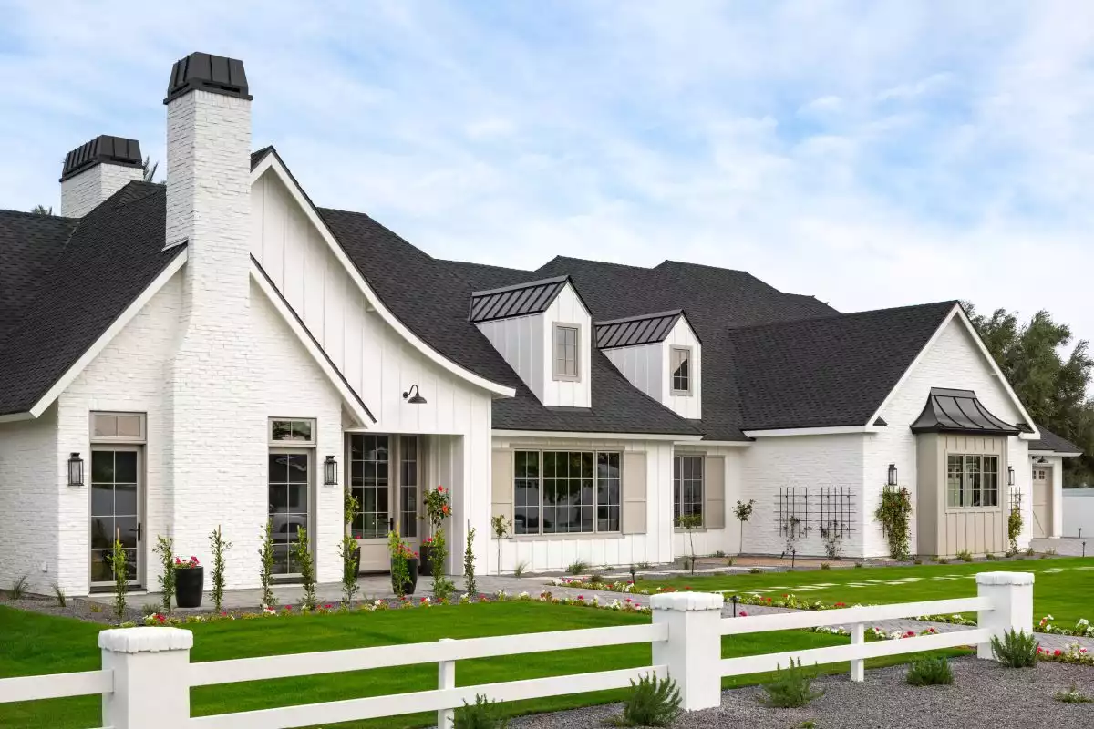 White farmhouse with vertical siding