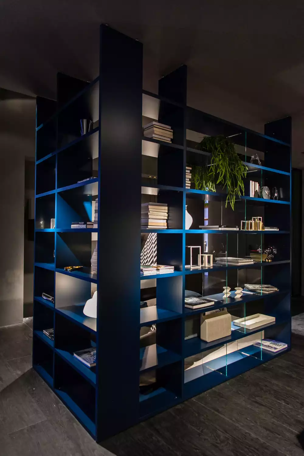 Blue floor to ceiling bookshelf