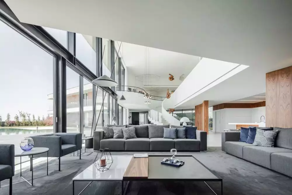 The actual living room is a large and cozy nook with plenty of space between the sofas and the central coffee table