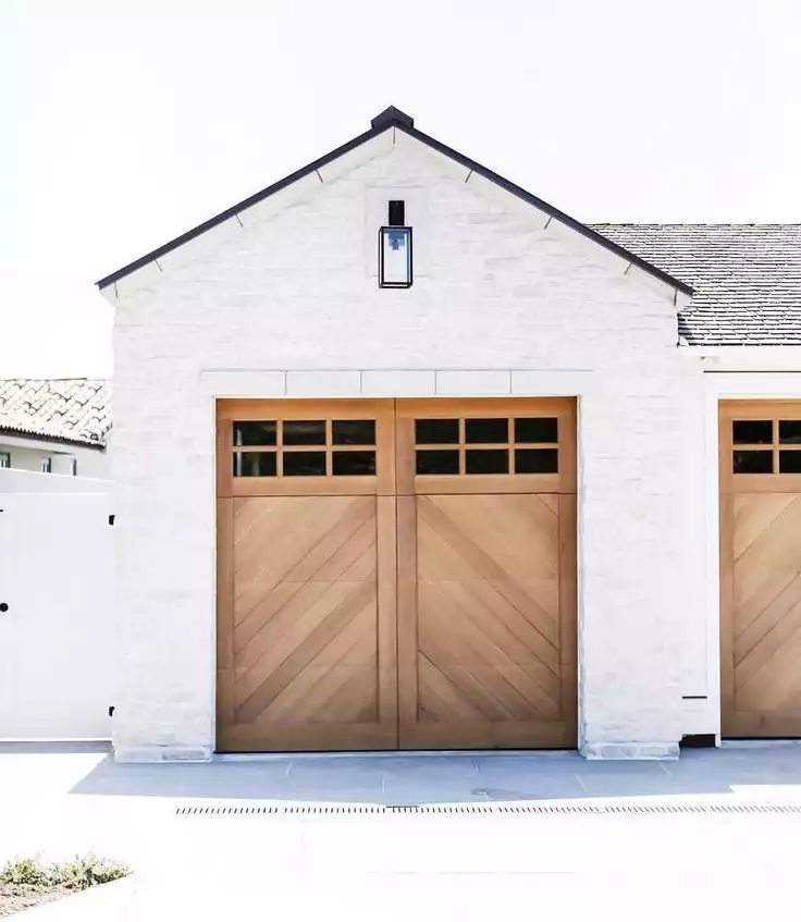 Accent White Painted Brick Exterior With Wood Doors