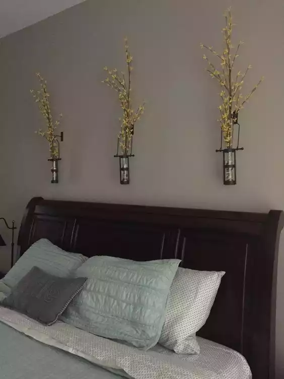 Glass flowers above the bed