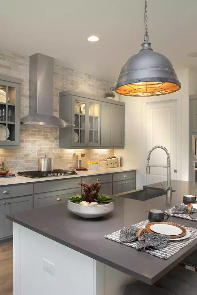 Gray Kitchen Cabinets and Warm Lighting