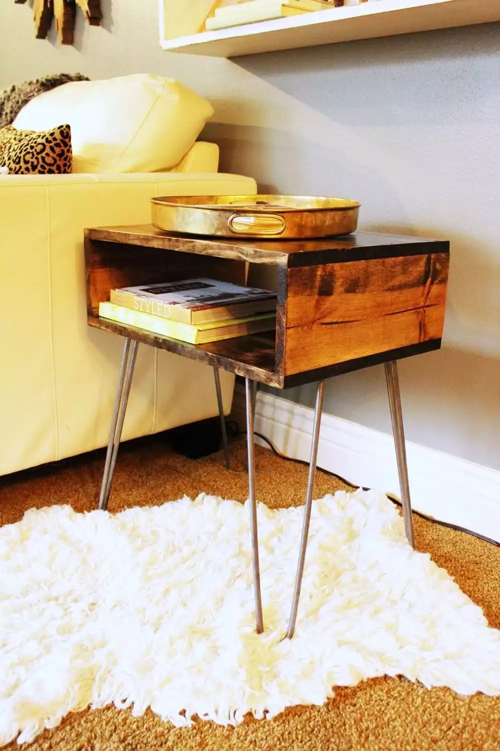 Mini table with hairpin legs and open shelf storage 