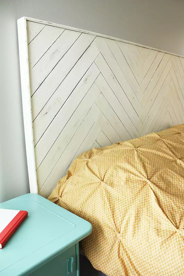 Classic herringbone-pattern headboard made of wood