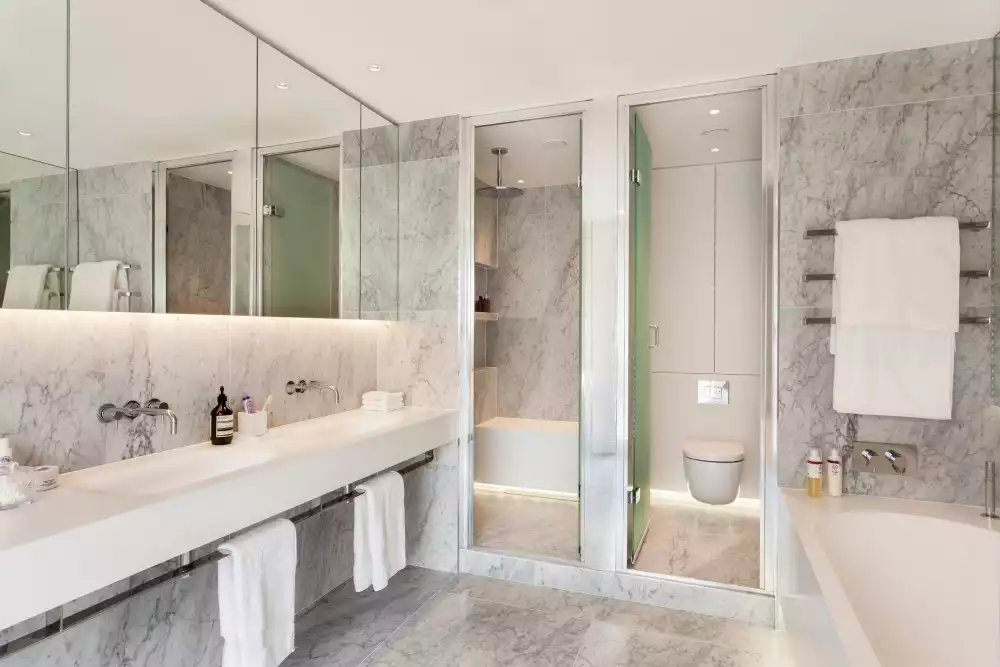 How a marble bathroom looks with walk in shower and double vanity