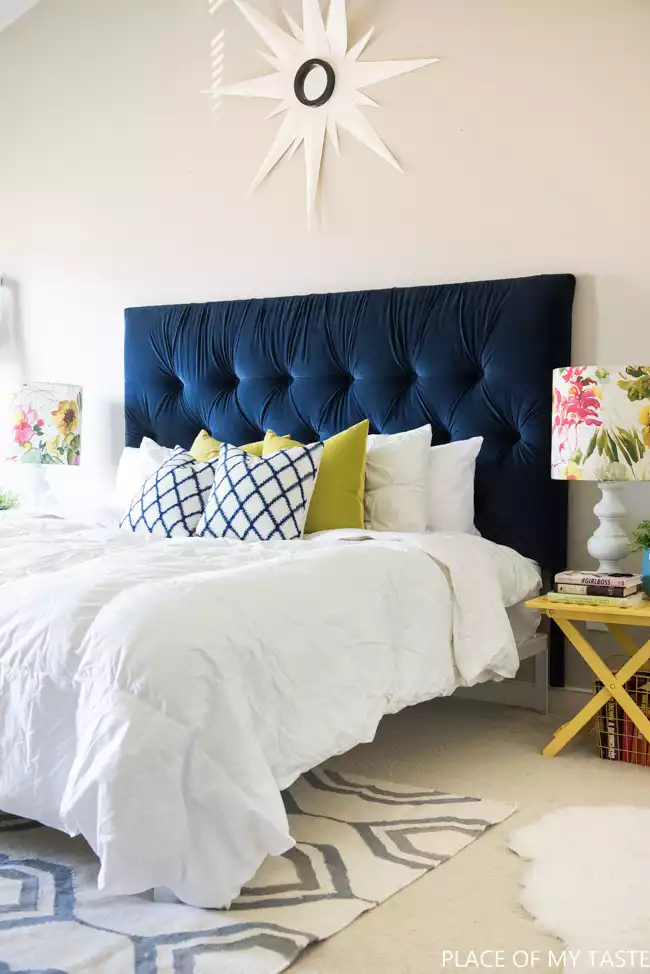 A classic fabric tufted headboard with a rich color