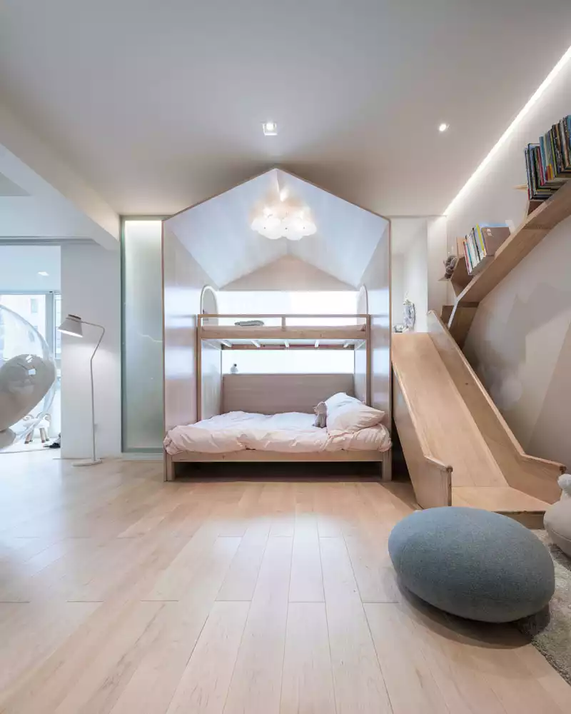 Kids room with canopy bed and slide