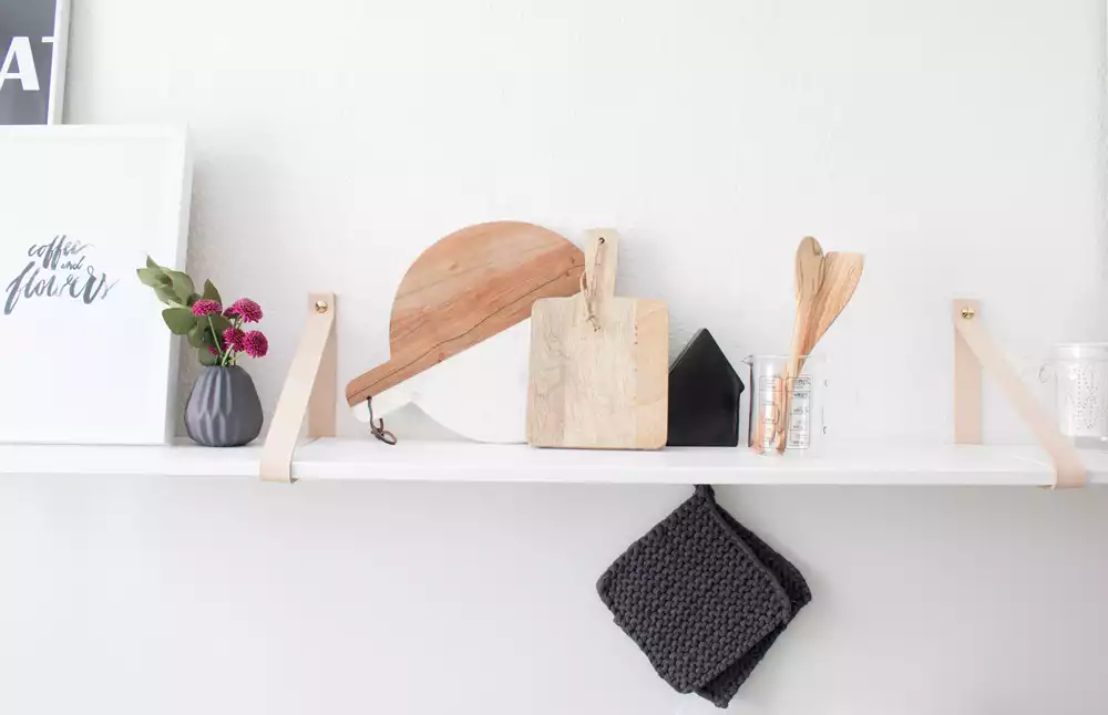 Kitchen shelf with leather straps