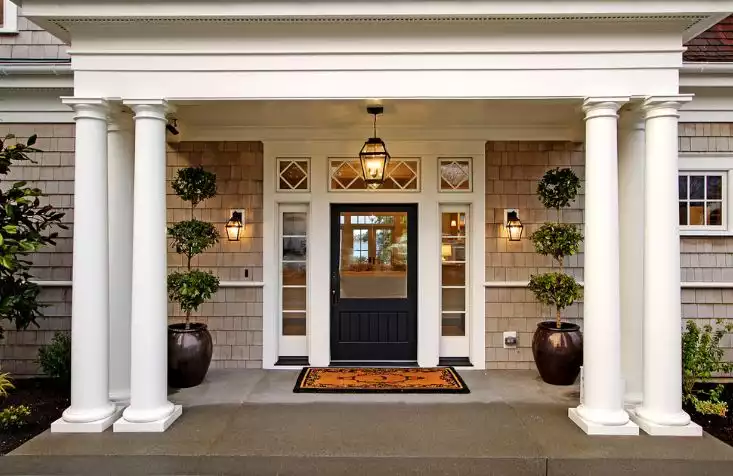 Large columns for entryway and black door