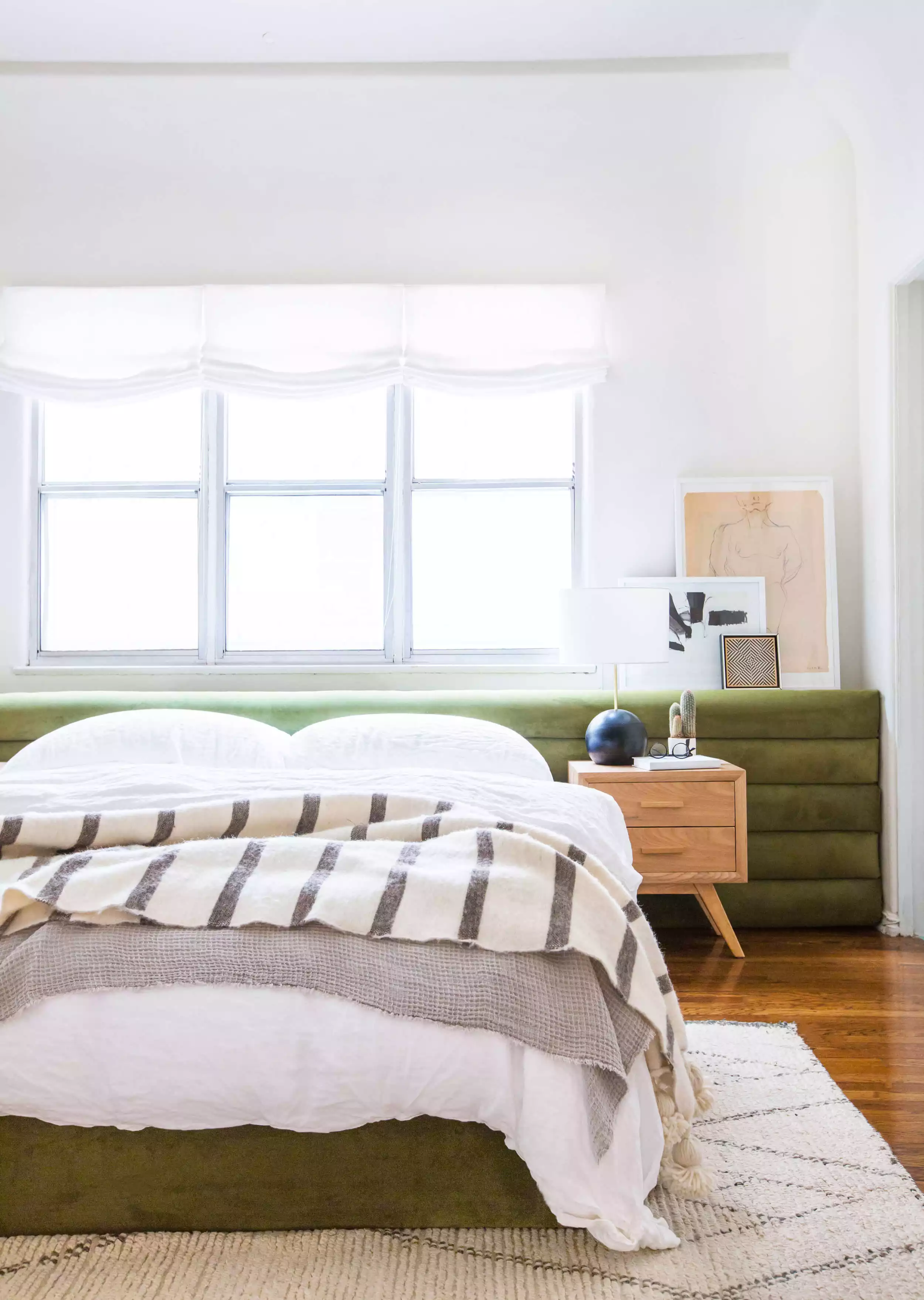 Extra wide tufted headboard and window ledge combo