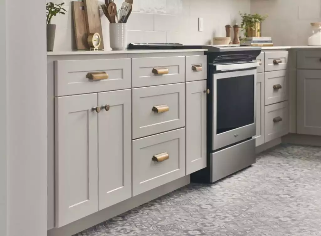 Light Gray Kitchen Cabinets with Warm Metallic Accents