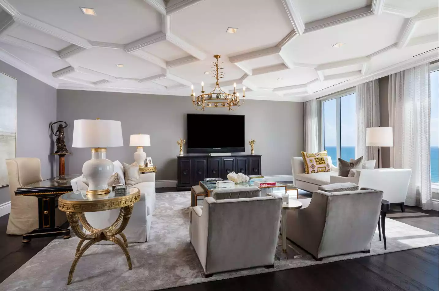 Living room with dark floor and coffered ceiling