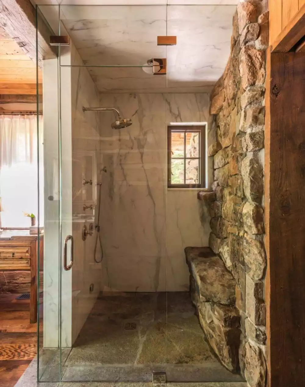 Marble and rocks for walk in shower Rustic Mountain Residence Bathroom Peter Zimmerman Architects